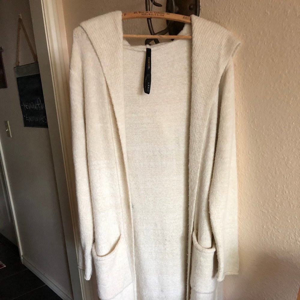 Full length cream colored sweater.